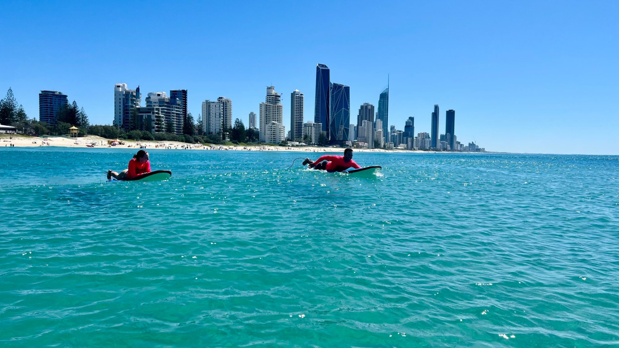 a large body of water with a city in the background